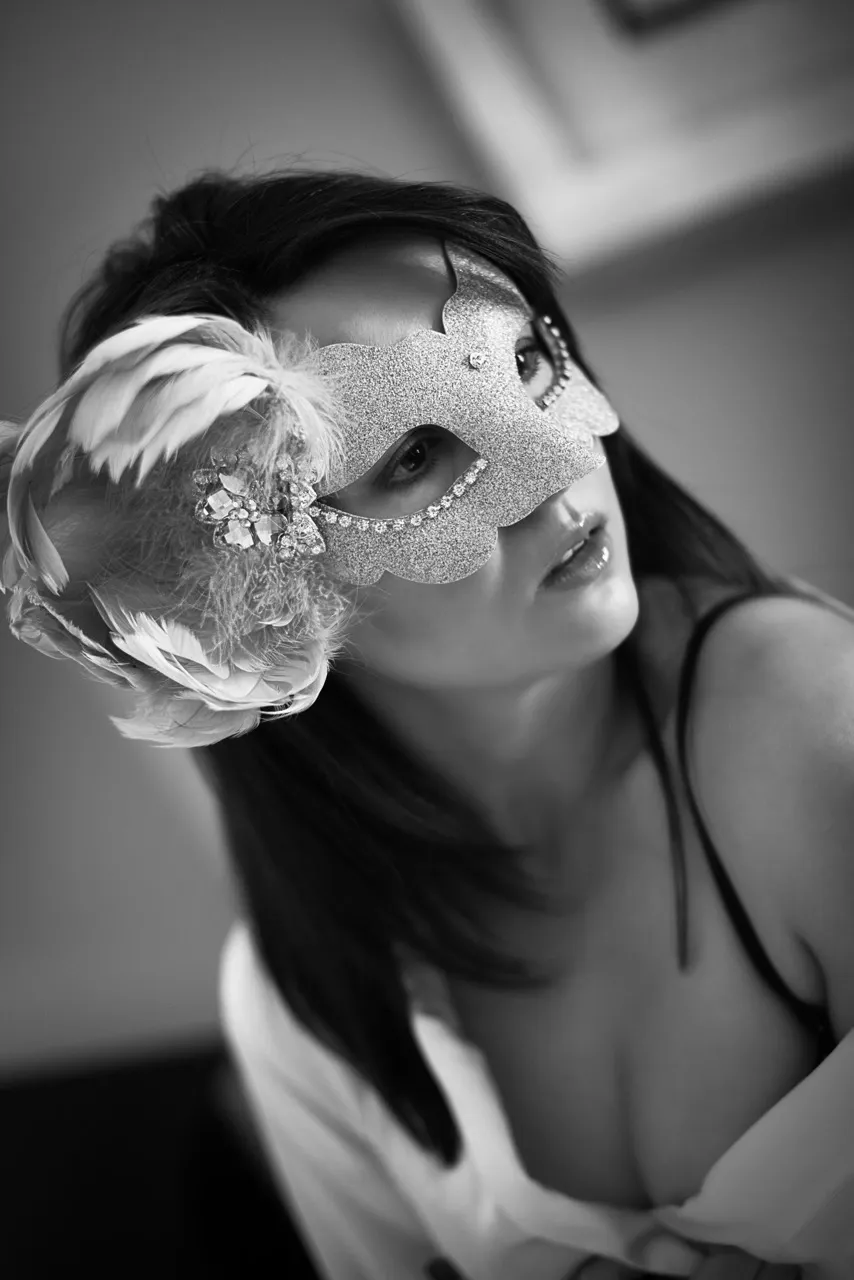 Feminine boudoir portrait featuring concealment, secrecy, and suggestion