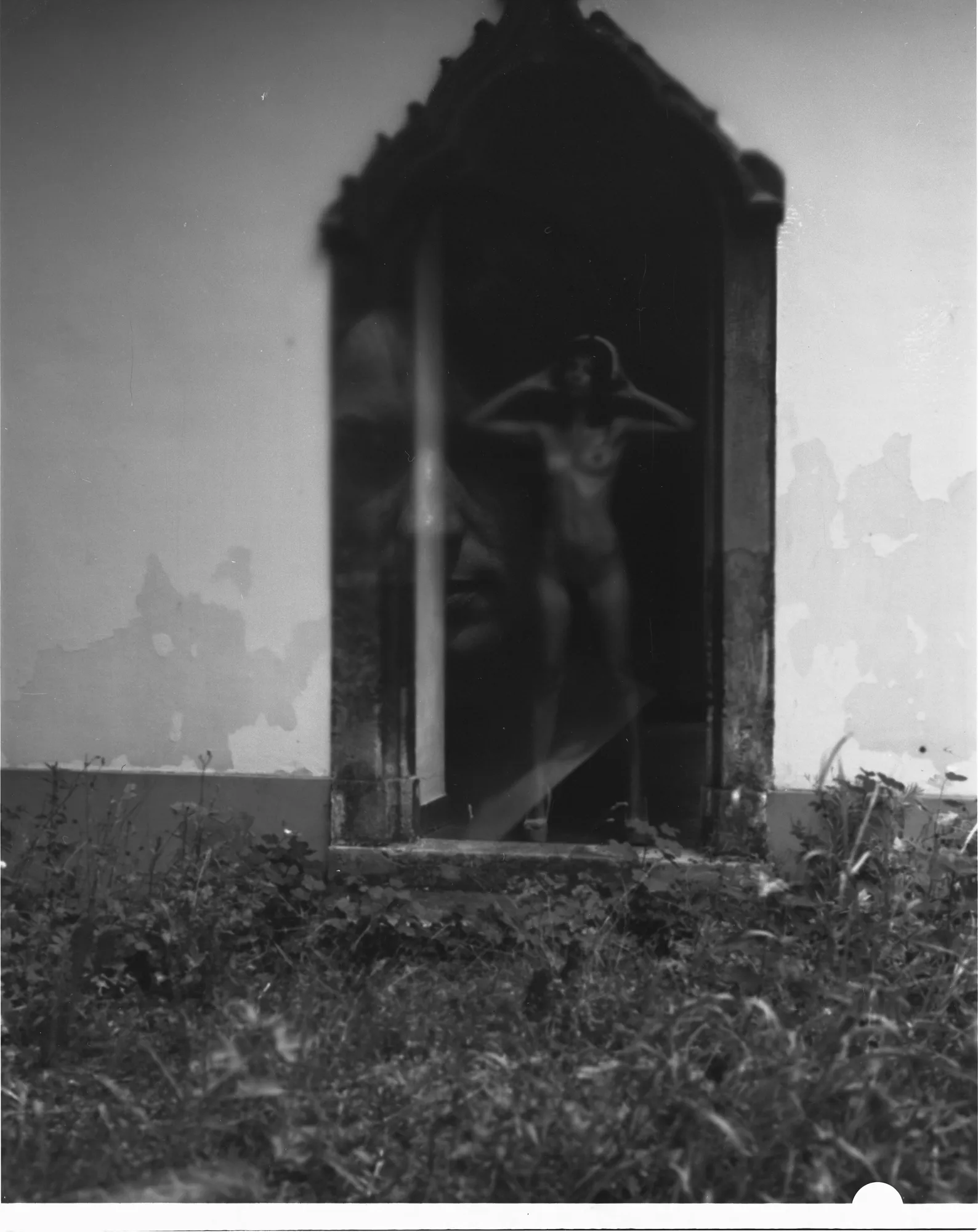 Analog outdoor nude photography by Pavol Hanuska blending the human body with natural architecture and soft film grain.